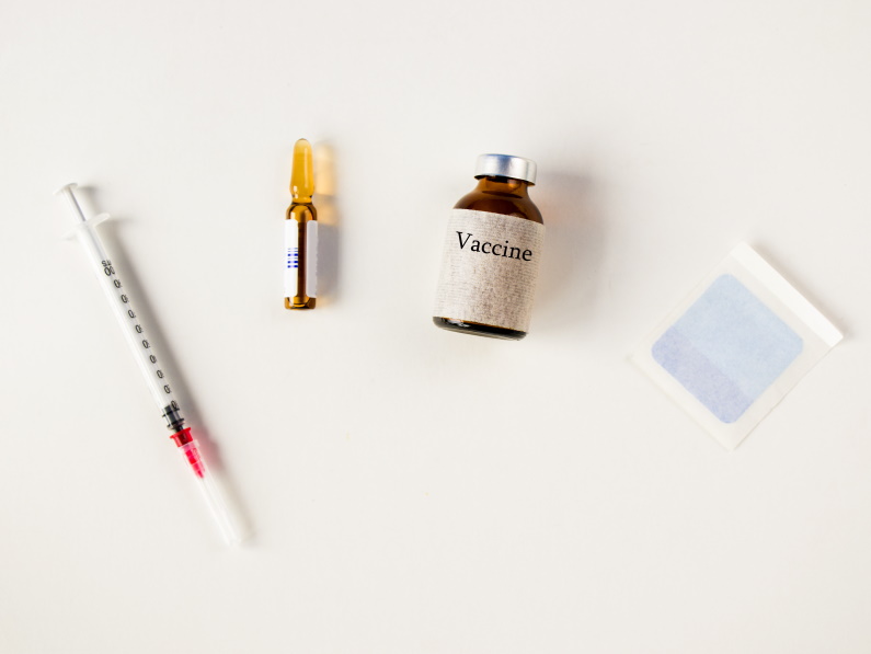 guaze, syringe, kids malaria vaccine bottle, and ampoule