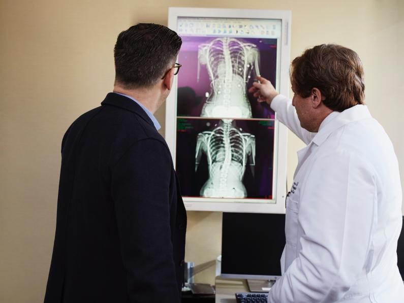 doctor discussing an x-ray reading