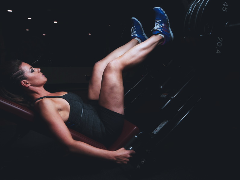 woman laying sideways working out